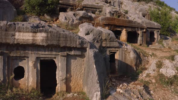 Close Up View of Many Ancient Tombs Carved in Rock alt