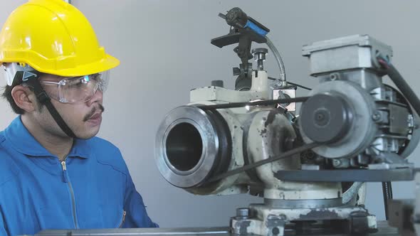 close up worker male hand manage machinery Side View Automatic Thin Metal Threads Reeled alt