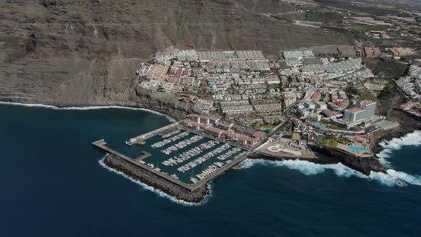Aerial view of Los Gigantes coastal town in Tenerife, Canary Islands, Spain alt