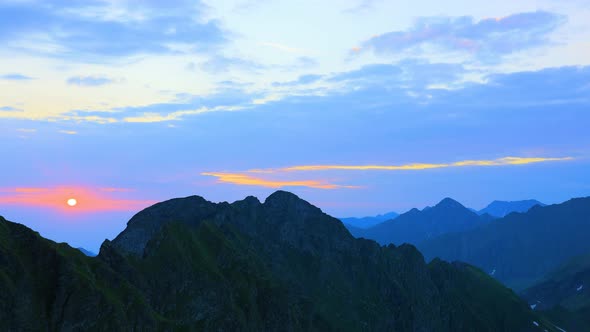 Time Lapse of a Silhouetted Blue Mountains and Horizon at Fagaras Mountains alt
