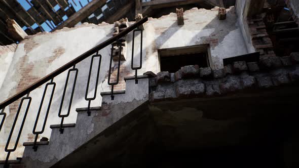 Destroyed Building and Pile of Debris After War alt