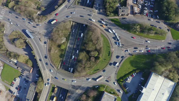 Aerial footage of a large section of commuter motorway, highway, during busy congestion, traffic, ru alt