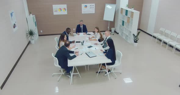 Business Meeting of Young Company Employees Modern Coworking Center alt