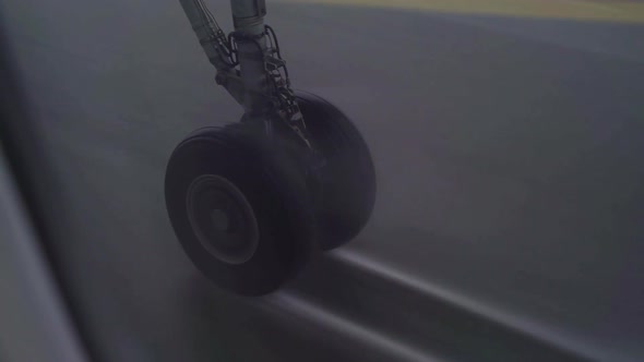 Airplane landing gear landing touch down in heavy rain alt