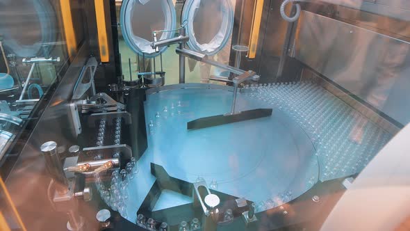 Sterile Medical Vials Standing on the Production Line of Medical Medicine Against Viruses alt