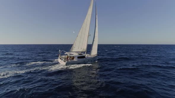 Sailboat Butting Through the Waves in the Mediterranean Waters alt