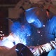 Industrial Worker Welding Steel in Protective Mask at Metalworking Factory - VideoHive Item for Sale