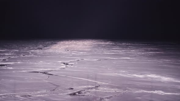 Icebreaker Ship Sails Through the Sea Ice in the Winter Arctic Night