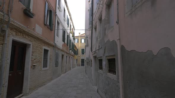 Paved street between old buildings