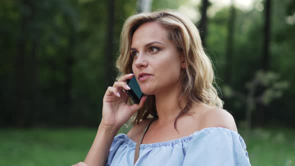Frustrated Woman Swearing on Phone, Close-up alt