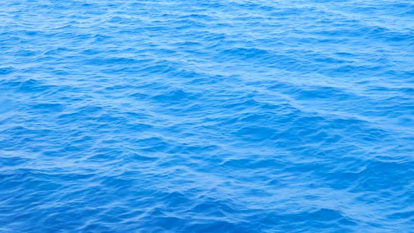 Background of Calm Sea. Sea with Little Waves Close Up. Sea Water Background. Blue Sea with Little