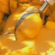 Super Closeup of the Spoon Slowly Scooping Frozen Mango Icecream Gelato - VideoHive Item for Sale