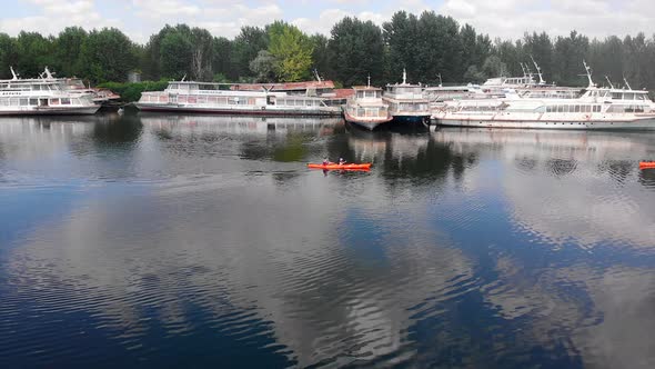 Drone Shot of People on Kayak Swimming Near Boats