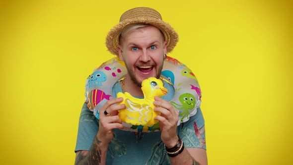 Traveler Tourist Adult Man Dancing Fooling with Swimming Ring and Duck Toy Travel on Weekends alt