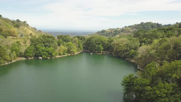 Aerial View of the Lake Among the Mountains on Tropical Island alt