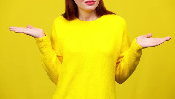 Unrecognizable Young Irritated Woman Gesturing in Slow Motion at Yellow Background alt