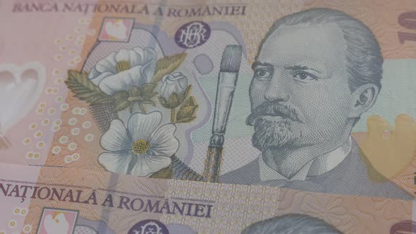 Paper money of  Romania 3840X2160p 30fps UltraHD video - Slow tilt over Romanian national currency l alt