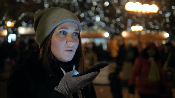 A Beautiful Young Woman Use Phone at Night Evening with Voice Recognition Ai Speech Audio Message alt