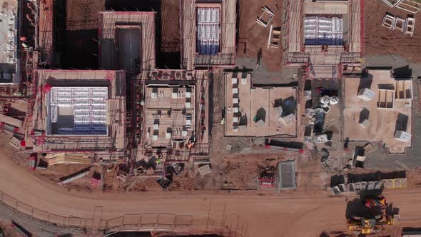 Brick Layers Working Bird's Eye View Construction Site Housing Estate Zooming Out Aerial 4K Cine D