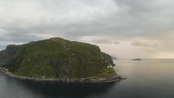 Hendanes Lighthouse ( Hendanes fyr) At Vagsoy Island In Kinn, Vestland County, Norway. - aerial alt