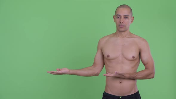 Stressed Bald Multi Ethnic Shirtless Man Showing Something alt