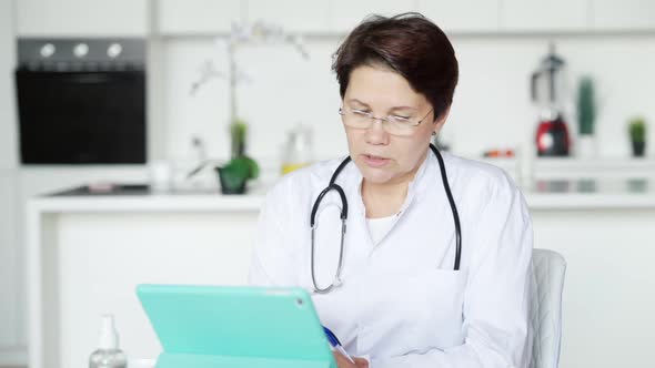 Concentrated Professional Doctor Consulting Patient Online Talking and Writing Symptoms alt