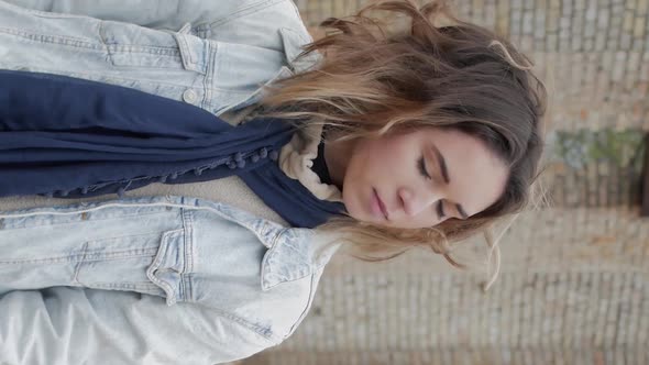 Vertical Video of Girl in Blue Scarf alt