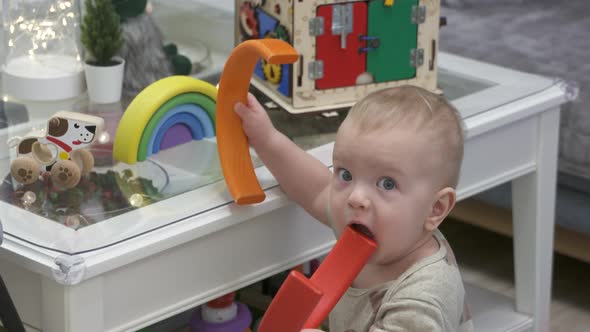 Cute Small Child Playing with Wooden Toys 10 Month Old Baby Boy Holding ...