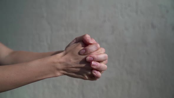 Woman Is Clenching Her Hands, Making Fist, Closeup of Palm, Gesticulating alt