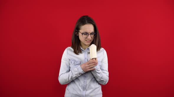 The Young Woman's Index Finger with a Bandage Is in Pain alt
