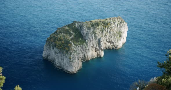 Top down view of the smallest of Capri's Faraglioni, the famous cliffs of this beautiful island alt
