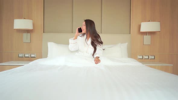 Young asian woman use smart phone alt