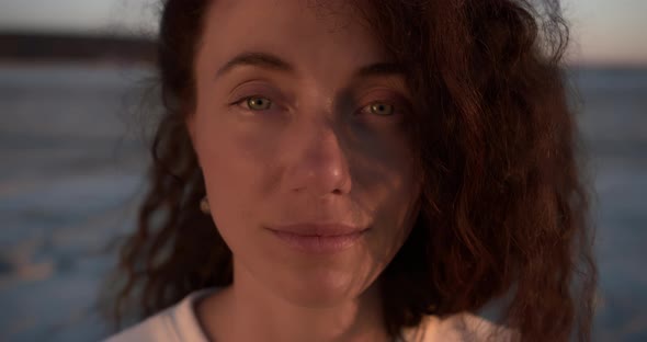 Portrait of a Young Woman Without Makeup in the Sunset Light alt