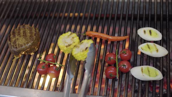 Chef Cooking Vegetable on the Grill in the Restaurant Kitchen alt