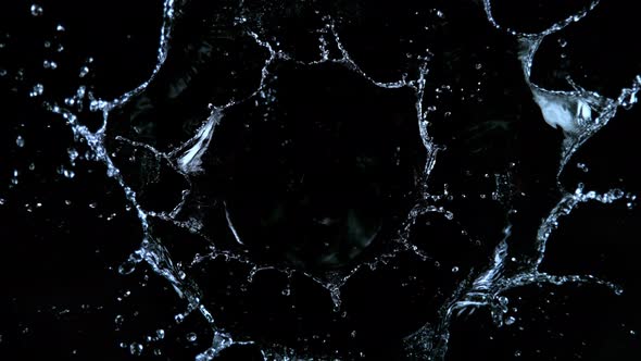 Super Slow Motion Shot of Water Splash Isolated on Black Background at 1000Fps alt