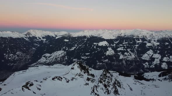 Snowy Mountain Skilifts and Furniculars and Skislopes in Austrian Alps Drone Flyover the Mountains