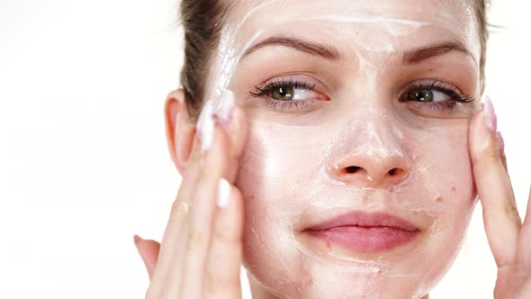 Woman Apply Mask Cream on Face