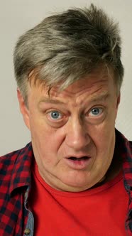 Handsome Man Senior Adult with Gray Hair in Casual Clothing Nods Affirmatively and Says Yes alt