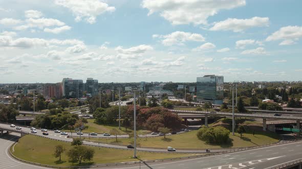 Aerial shot rising over Panamericana highway and General Paz Avenue in Buenos Aires alt