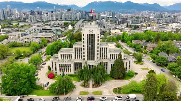 Vancouver City Hall With Skyline Of  Downtown Vancouver In The Background In Canada. - aerial pullba alt