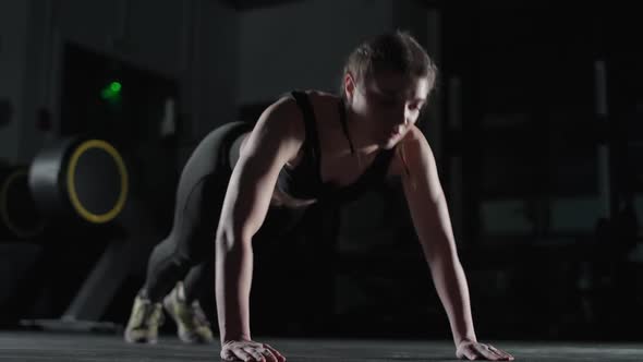 Athletic Female Fighter in Gym Strong Woman Performs Explosive Push Ups Clapping Push in Slow Motion alt