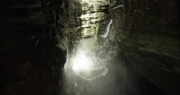 Water splashes from a large stone that falls into the rivers