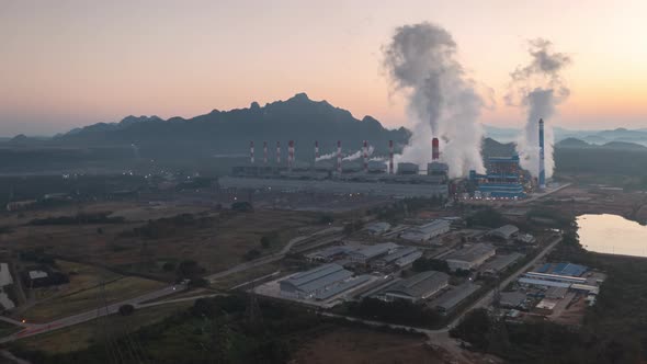 Beautiful Landscape in the morning time with fog and background Mae moh coal power plant.