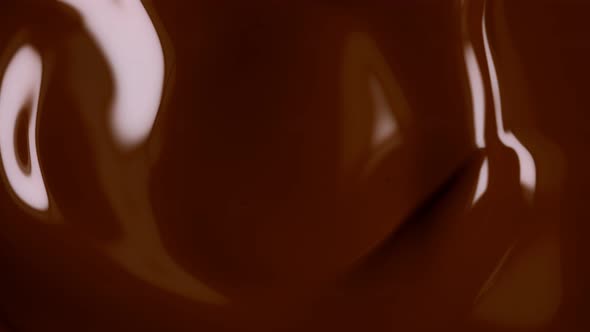 Super Slow Motion Shot of Swirling Chocolate Background at 1000Fps alt