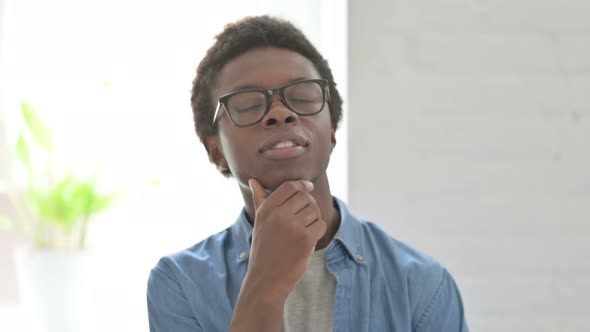 Portrait of Pensive Young African Man Thinking New Plan alt