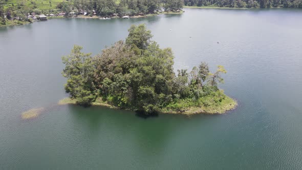Aerial view of lake side with park and mountain in Bandung, Indonesia alt