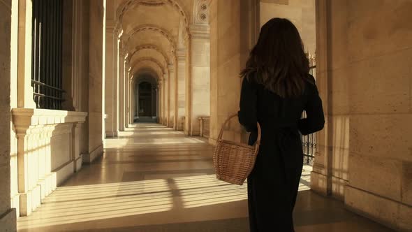 Slow Motion Rear View of Woman in Black Dress Walking in Paris France