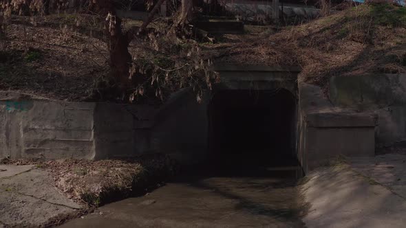 The River Flowing in a Concrete Reservoir in the City