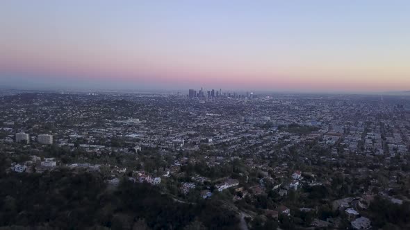 Los Angeles city center skyline seen from above at night. alt