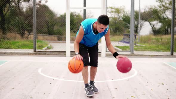 Closeup View of a Young Man Practicing Basketball on the Street Court alt